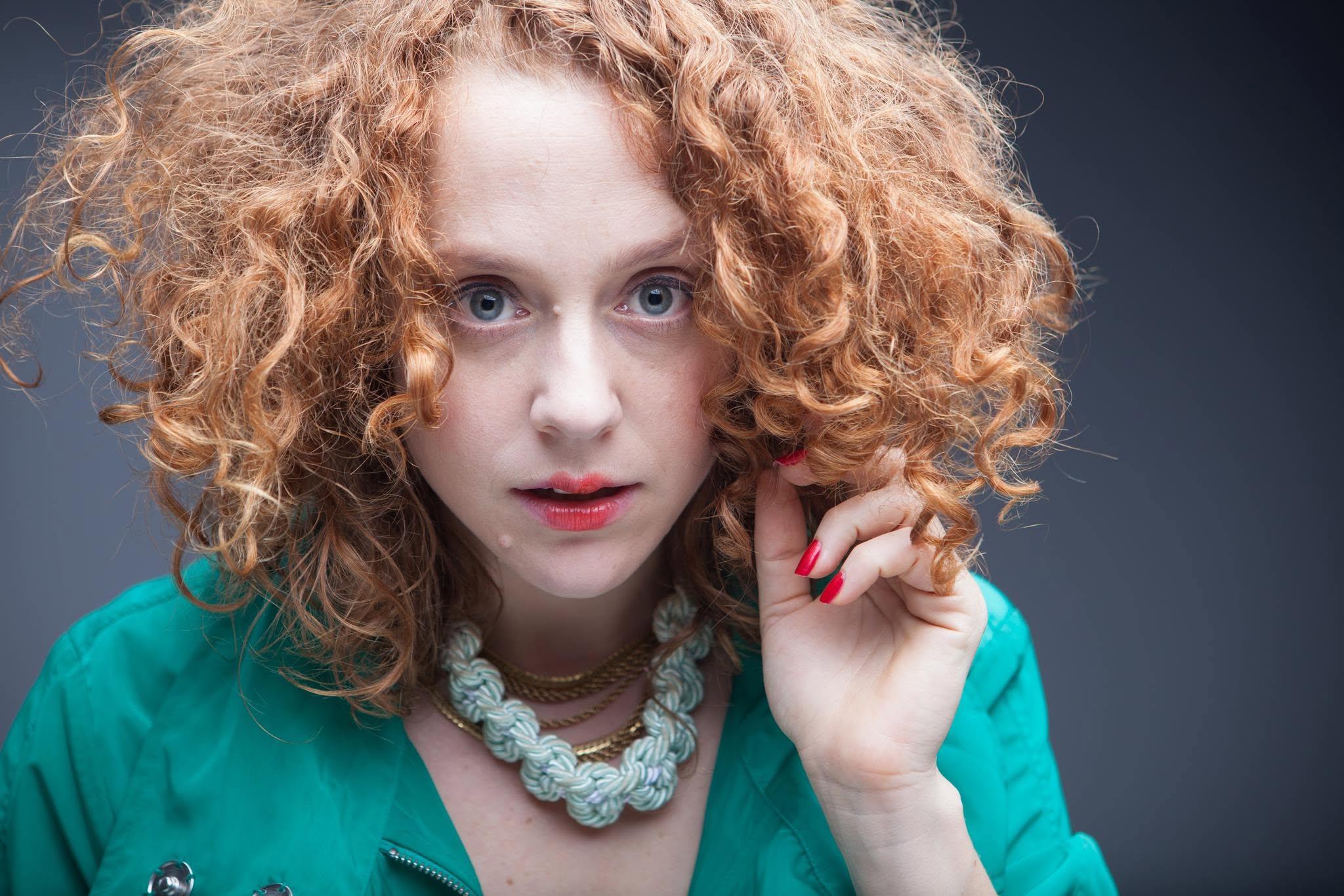 Portrait of Noa in a turquoise jacket